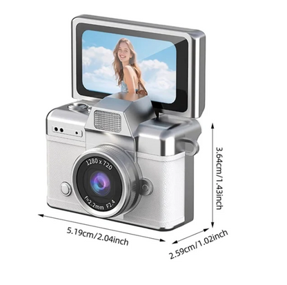 A mini, compact digital camera with a 1.47-inch LCD screen.